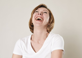 young beautiful red hair woman laughing happy and cheerful in friendly smile