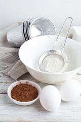 bowl with the flour, cocoa and egg closeup