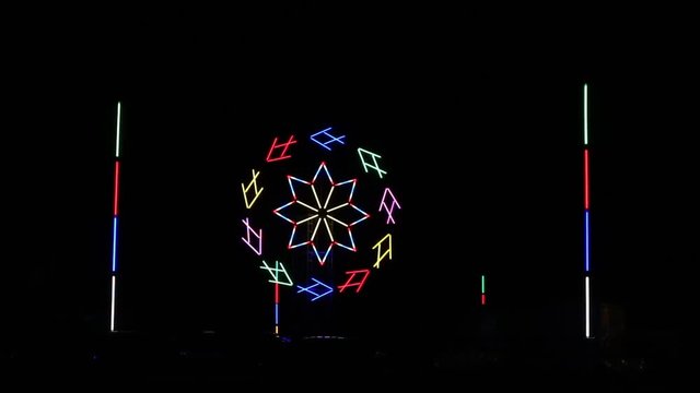 Colorful clock light effects in the festival night.