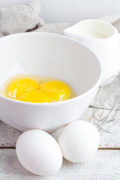 ingredients for omelet on a white wooden background close-up