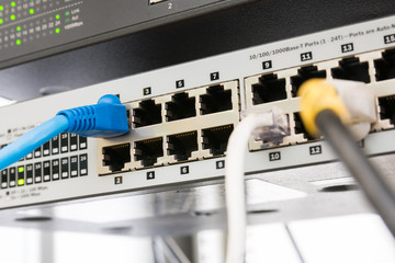 Close up of Network switch and ethernet cables in server room