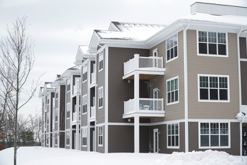modern apartment building after winter snow storm