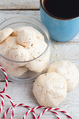 meringue in a glass jar and black coffee view from above
