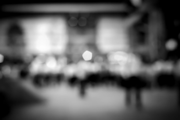 Abstract bokeh background of business people meet at bar on happy hour with B&W color