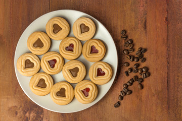 Plate of cookies with coffee beans and copyspace