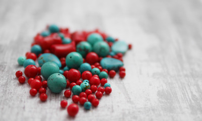 A scattering of beads of turquoise and coral. Materials for handmade jewelry.