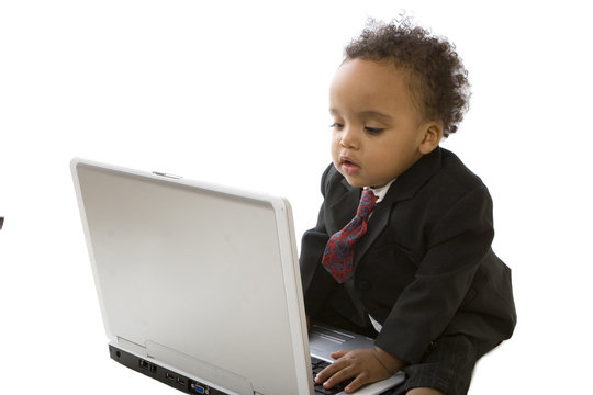 African American little boy surfing the internet.