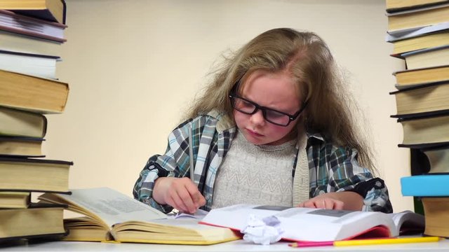 Little girl excitedly pulls a page from the book information. White background. Slow motion