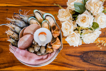 seafood in bucket with flower