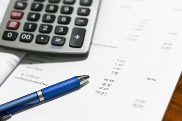 Financial accounting stock  analysis ,calculator and stationery items on the table , selective focus