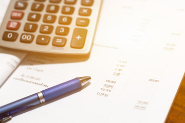 Financial accounting stock  analysis ,calculator and stationery items on the table , selective focus