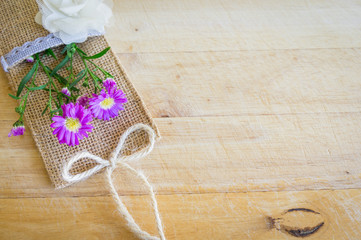 Pink and white flowers on  wooden background. Flat lay. Top view with copy space. Selective focus.