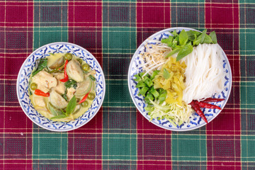 Rice noodle and green chicken curry in coconut milk.