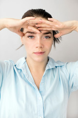 Beautiful woman making herself a face massage