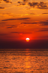 red sunset over water