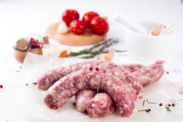 Raw sausages on slate