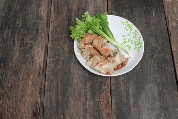 spring rolls with Onion and fresh vegetable on a wooden table