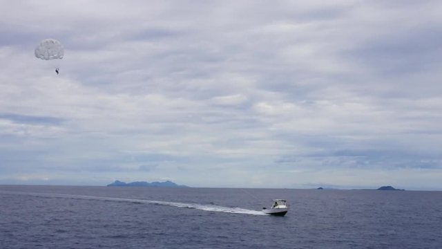 Silhouette of a Parasailing activity in the Mamanucas Islands of Fiji