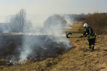 Fototapeta premium picture of firefighters battle a wildfire