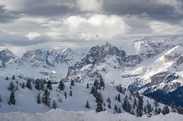 Fototapeta na wymiar Foggy view of Dolomite Alps from viewpoint of Passo Pordoi near Canazei of Val di Fassa, Trentino-Alto-Adige region, Italy.