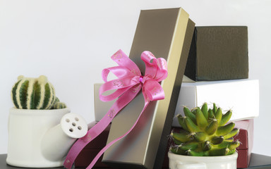 Gift box with ribbon bow.
