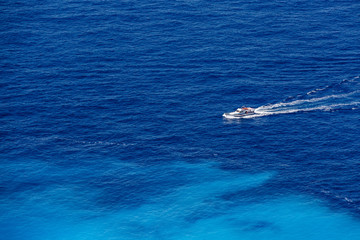 Boat in the blue sea