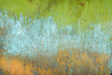 texture of old rusty shabby background with scratches, with the remains of green and blue paint