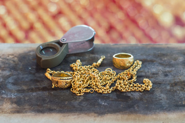 Jewelry gold and scope on the tie burned