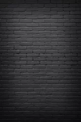 Selbstklebende Fototapete Ziegelwand Teil der schwarz gestrichenen Backsteinmauer