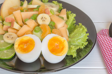 Fruit salad and boiled eggs