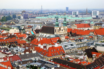 Fototapeta na wymiar Travel to Vienna, Austria. The view on the city and the roofs of houses.