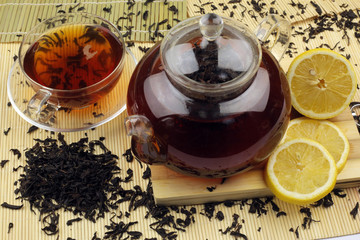 Glass teapot with black tea
