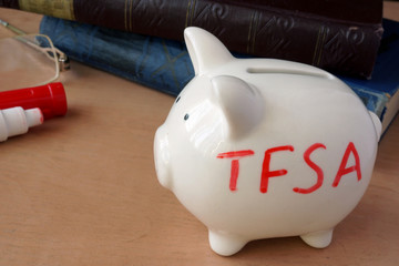 Piggy bank with word TFSA. Tax-free savings accounts.