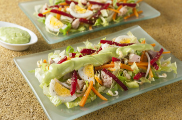 assorted salad with avocado sauce
