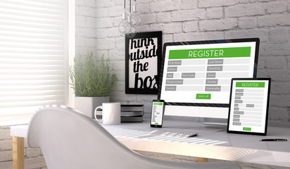 Devices with a registration form on the screen on a workplace mockup