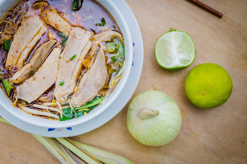 noodle duck with lime and onion on table