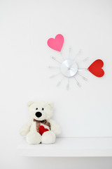Clock with hearts on the wall