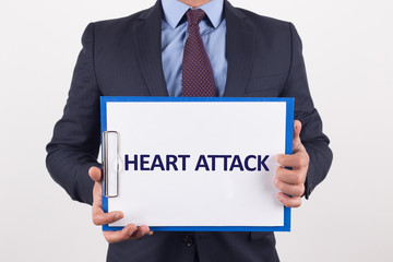 Man showing paper with HEART ATTACK text