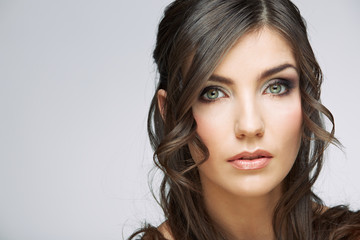 Young beauty woman face close up portrait. Female model with long hair.