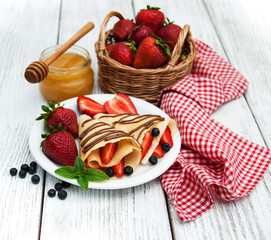crepes with strawberries and chocolate sauce