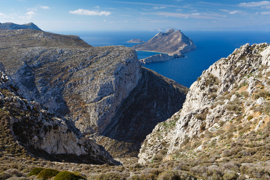 View of the rough coastline of Amorgos island and Nikouria islan in background.