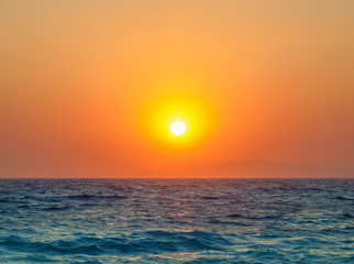 Fototapeta na wymiar Mediterranean sea beautiful orange sunset travel background.