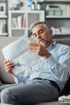 Businessman reading a newspaper