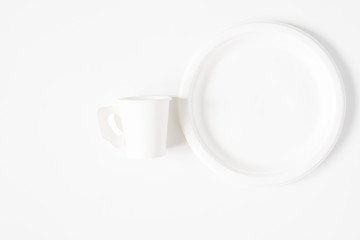 Take-out coffee cup and dish isolated on white background