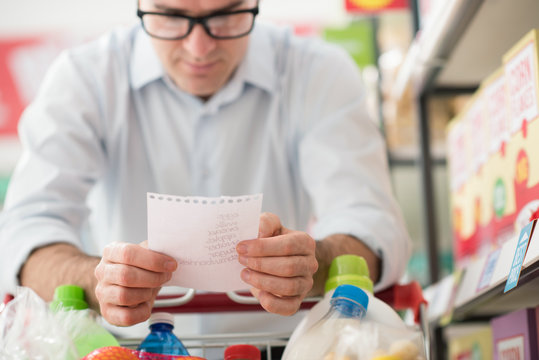 Man Shopping With A Grocery List