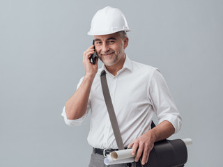 Construction engineer using a smartphone