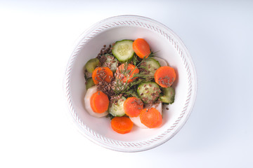 Vegetable salad with carrot on a white background isolated