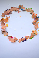 pretty unusual frame of colored wooden shavings from pencils, texture, background