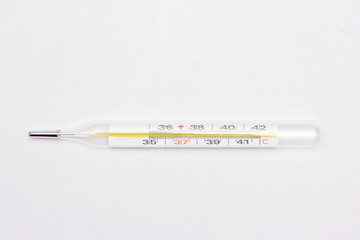 Medical thermometer for measuring temperature on a white background.