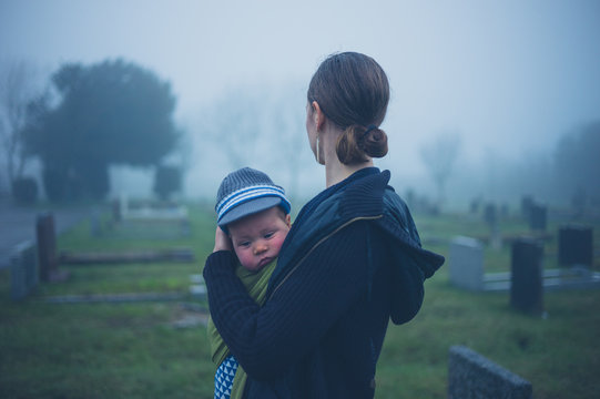 Mother and baby in graveyard